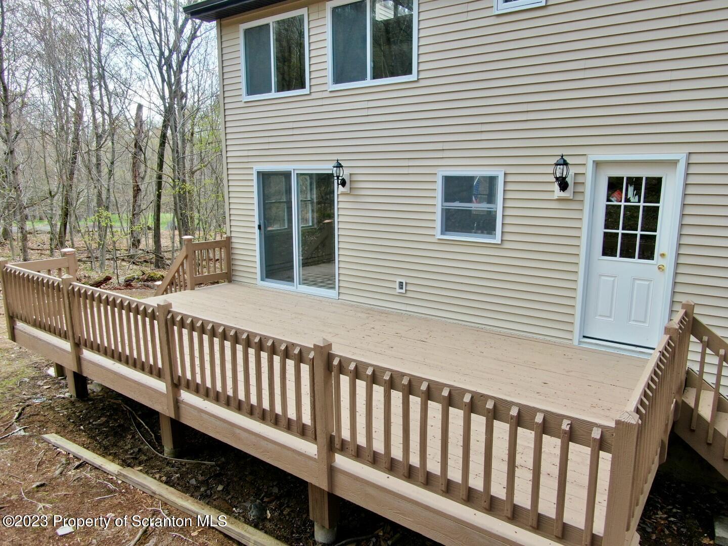 1013 Hemlock Way Newfoundland, PA 18445 - Photo 7 of 44 a view of a house with a small yard