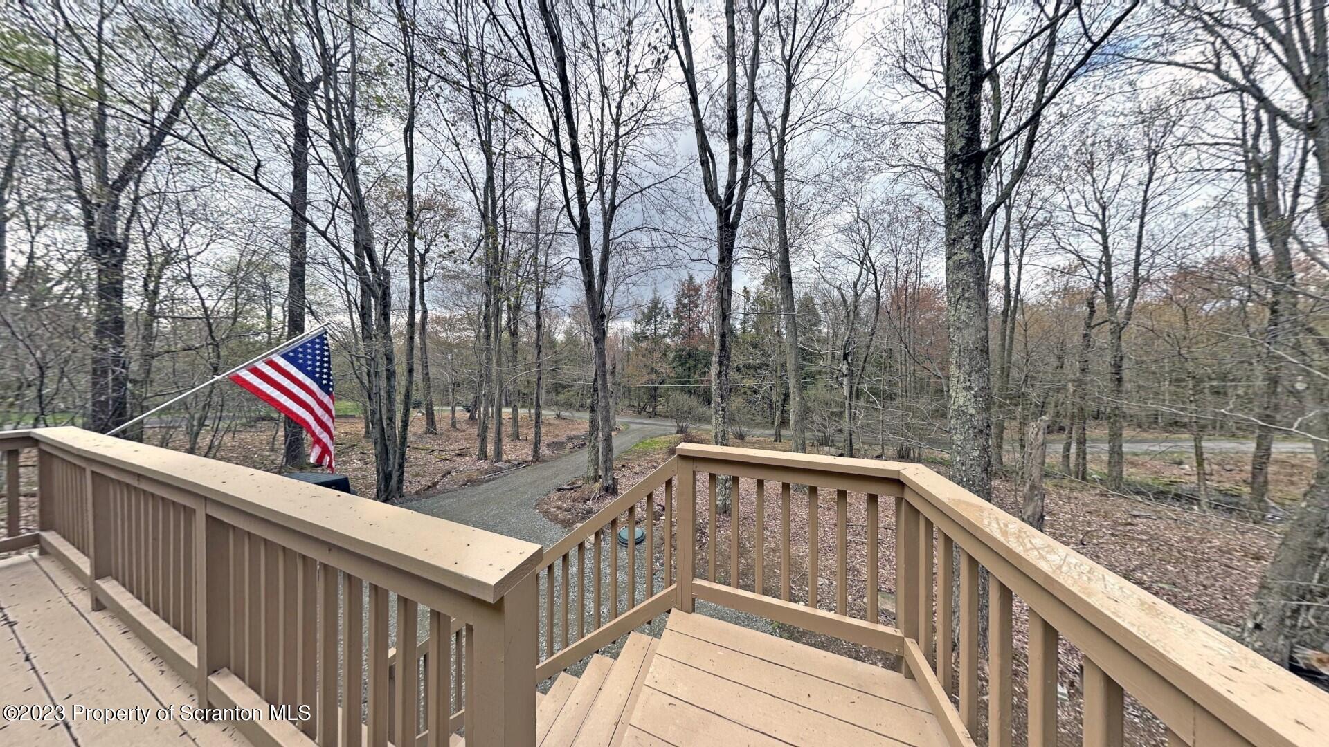 1013 Hemlock Way Newfoundland, PA 18445 - Photo 10 of 44 a view of a wooden deck and trees from a terrace