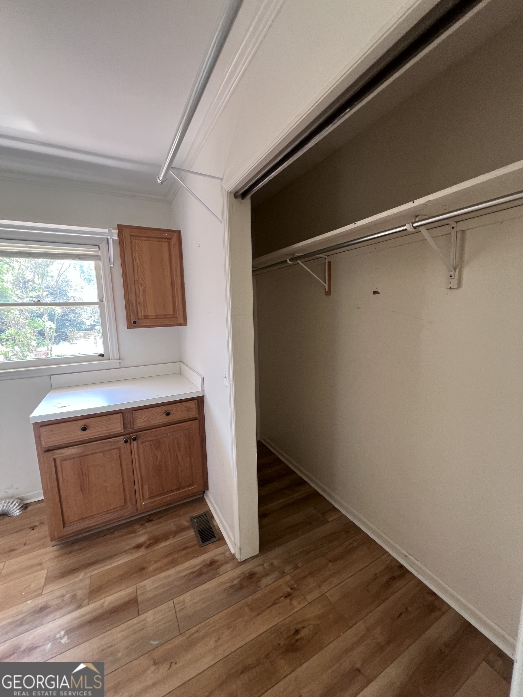 2205 Stonewall Street Dublin, GA 31021 - Photo 15 of 20 a room with wooden floors and window