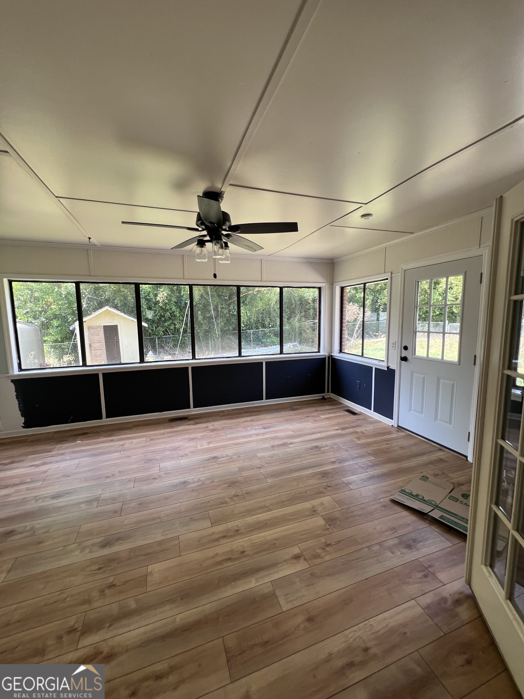 2205 Stonewall Street Dublin, GA 31021 - Photo 18 of 20 an empty room with wooden floor and windows