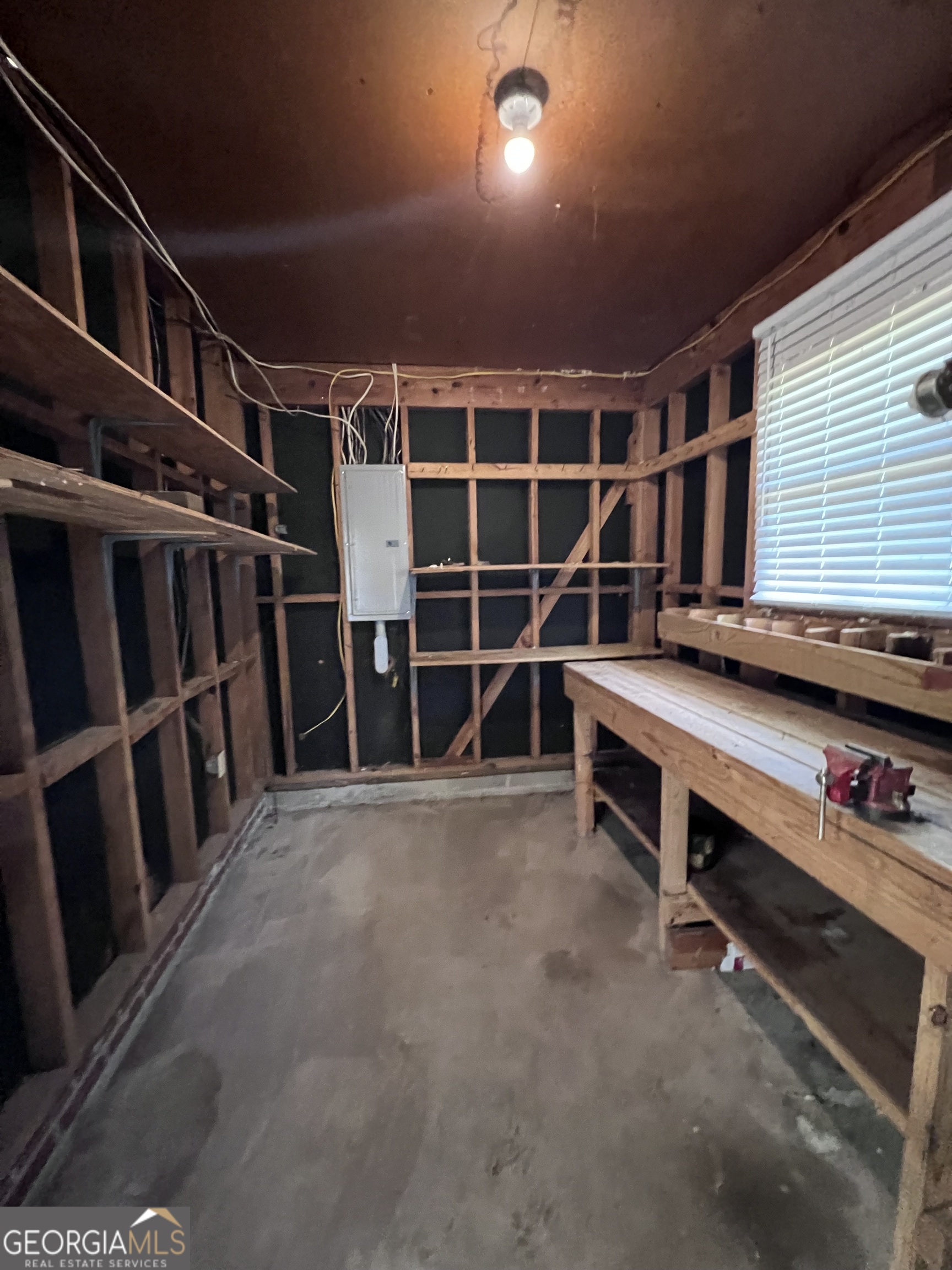 2205 Stonewall Street Dublin, GA 31021 - Photo 19 of 20 a view of an empty room with wooden floor and furniture