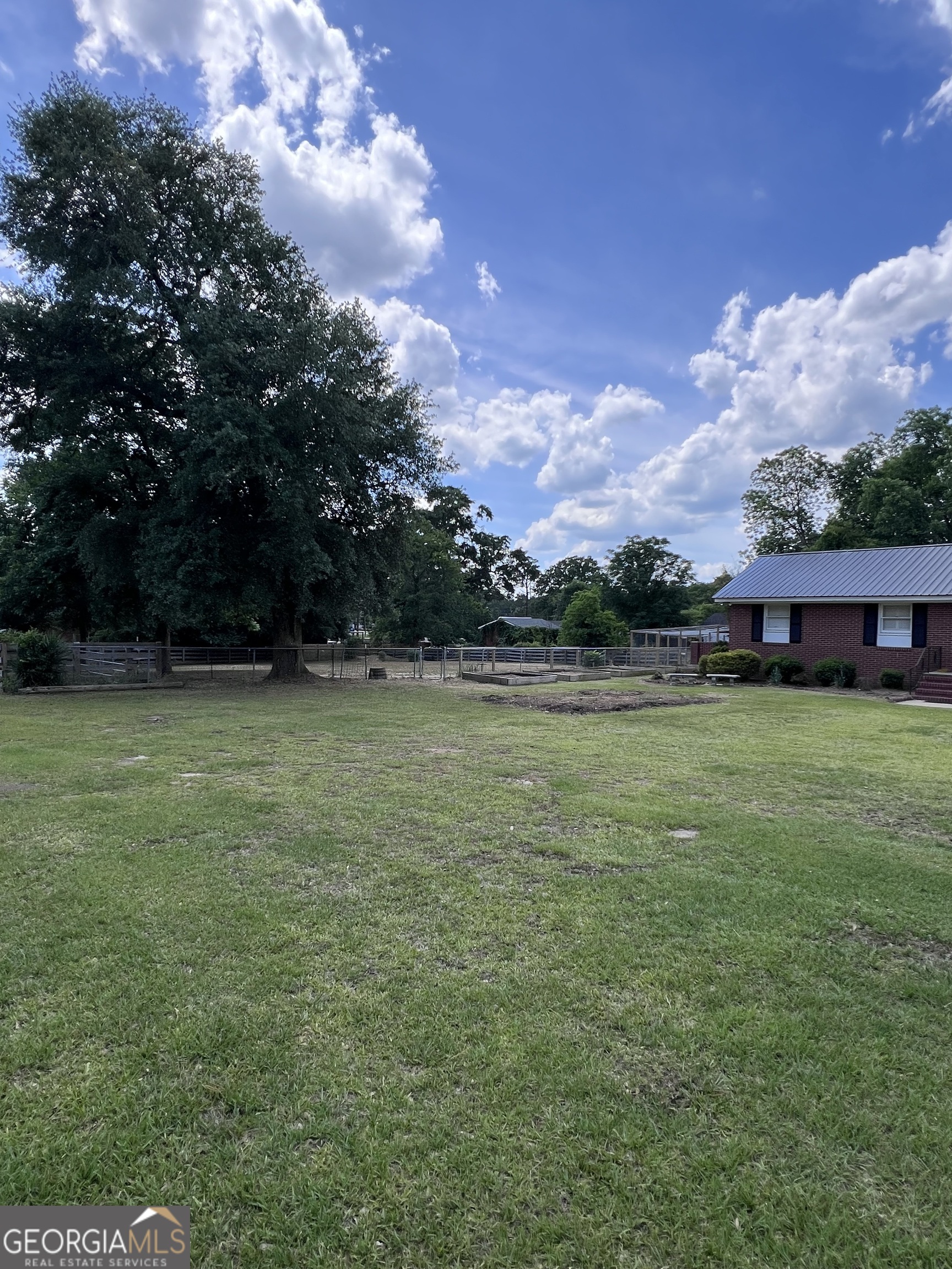 2205 Stonewall Street Dublin, GA 31021 - Photo 2 of 20 a view of outdoor space with deck and yard