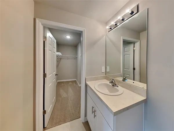 a bathroom with a sink and mirror