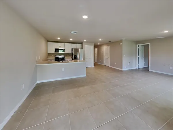 a view of a kitchen with a sink and cabinets