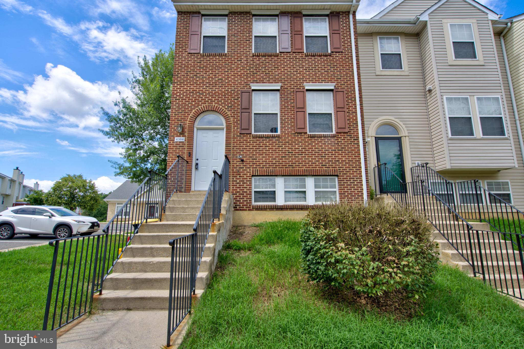 4304 Applegate Lane, Unit 2 Suitland, MD 20746 - Photo 1 of 27 a front view of a house with a yard