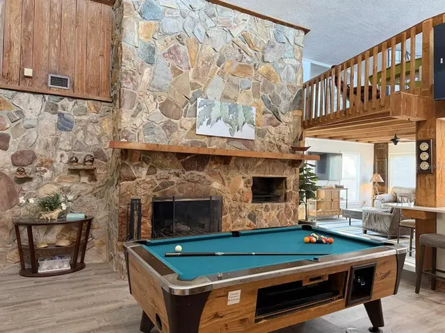 a bathroom with a sink a toilet a mirror and shower