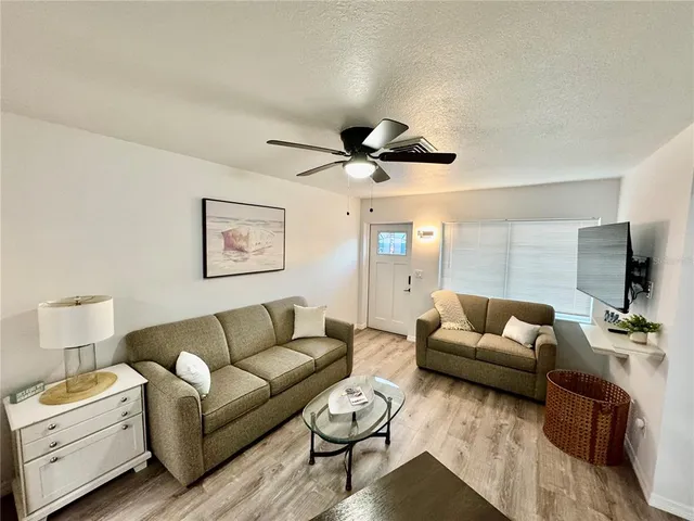 a living room with furniture and a window
