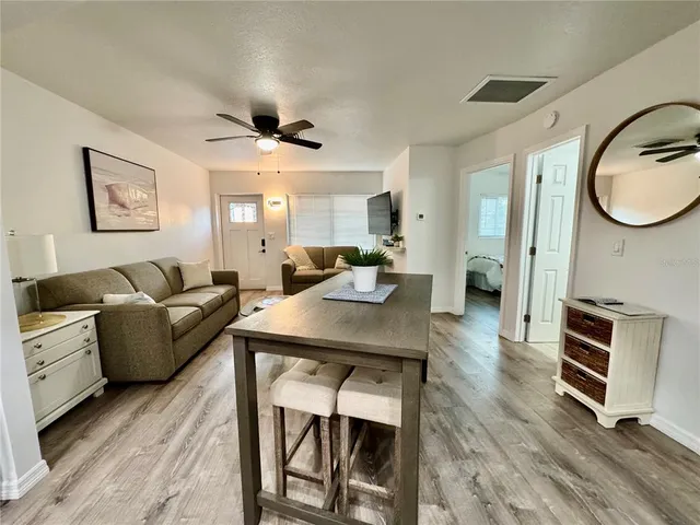 a backyard of a house with table and chairs