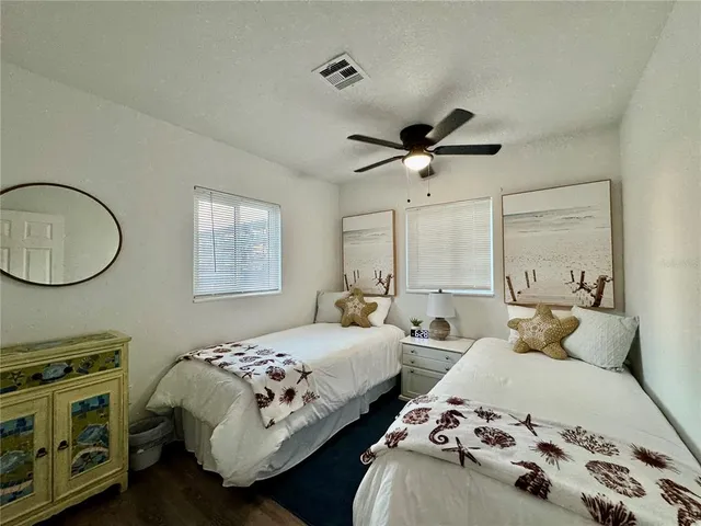 an aerial view of a house with swimming pool outdoor seating and yard
