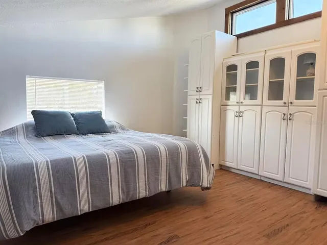 a view of an entryway with wooden floor