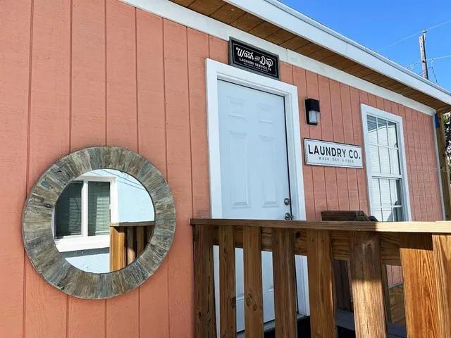 a view of an entryway with wooden floor