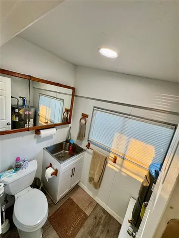 a living room with furniture a dining table and kitchen view