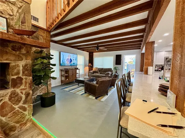 a view of two chairs in a balcony