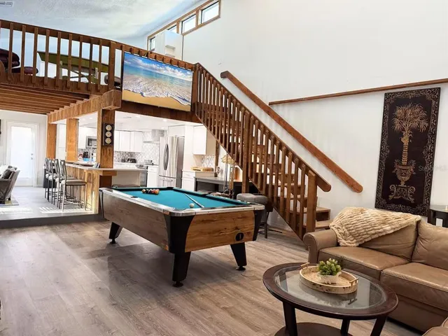 a bedroom with furniture and a flat screen tv