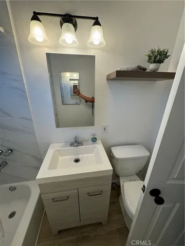 a view of a cars park in front of a building