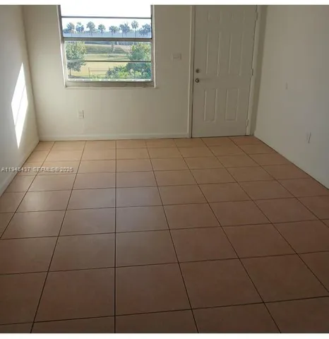 a view of a livingroom and window