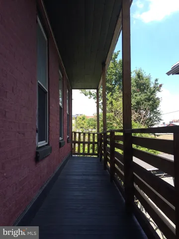 a kitchen with cabinets a refrigerator and a sink