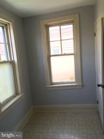 a bathroom with a sink mirror and toilet