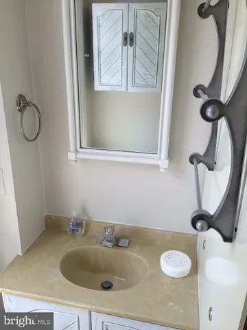 a kitchen with stainless steel appliances a stove and cabinets