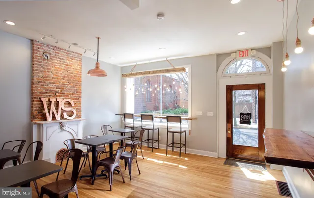 a view of a balcony dining table and chairs