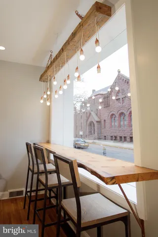a bathroom with a sink mirror and toilet