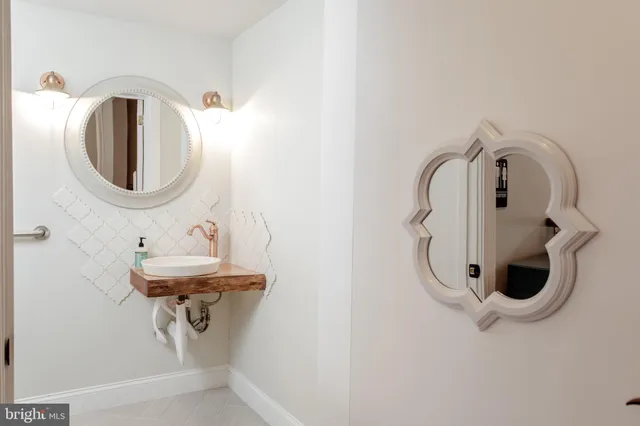 a dining hall with granite countertop wooden floor