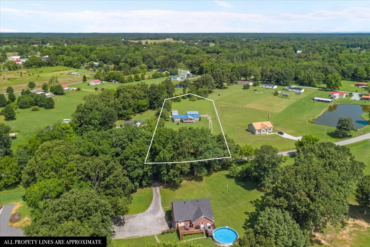 1112 Garners Creek Road Dickson, TN 37055 - Photo 3 of 57 an aerial view of a houses with a yard
