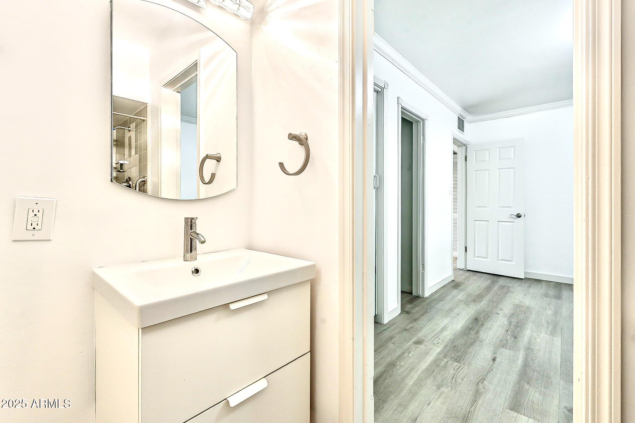 2150 West State Avenue Phoenix, AZ 85021 - Photo 19 of 32 a bathroom with a sink and a mirror