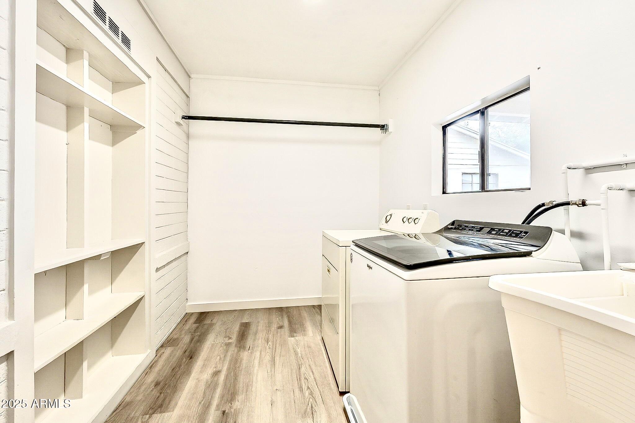 2150 West State Avenue Phoenix, AZ 85021 - Photo 28 of 32 a kitchen with a sink and a refrigerator