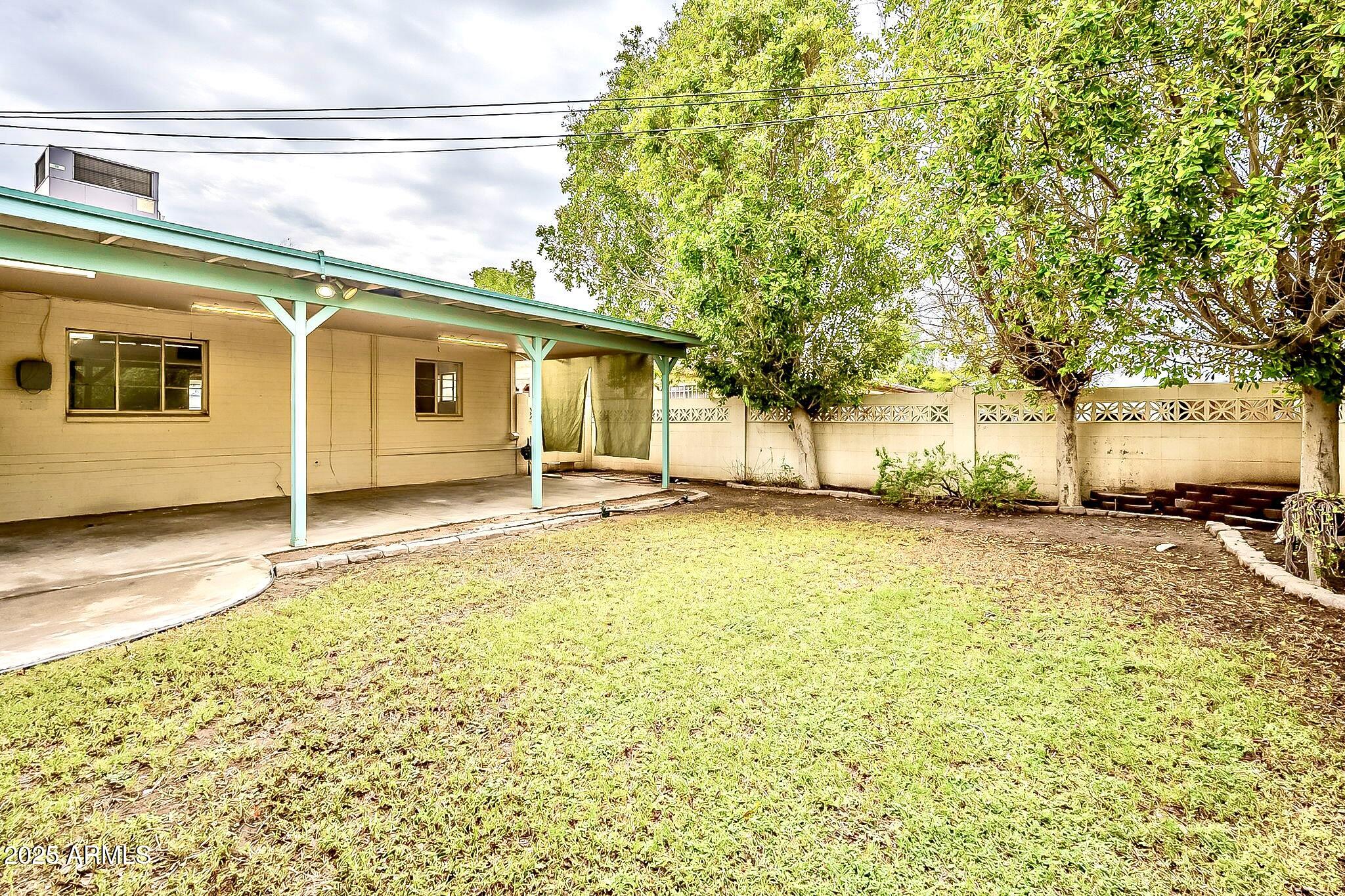 2150 West State Avenue Phoenix, AZ 85021 - Photo 31 of 32 a view of a house with a backyard