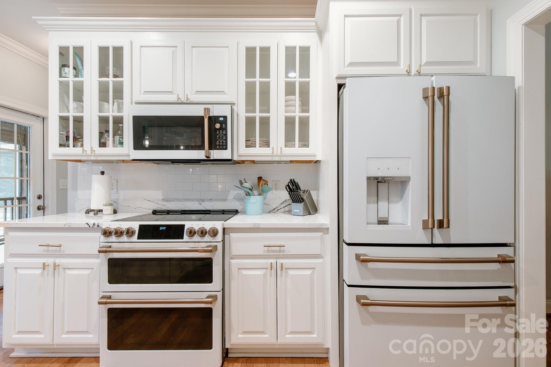110 Mandy Lane Tryon, NC 28782 - Photo 13 of 48 a kitchen with stainless steel appliances granite countertop white cabinets and a stove