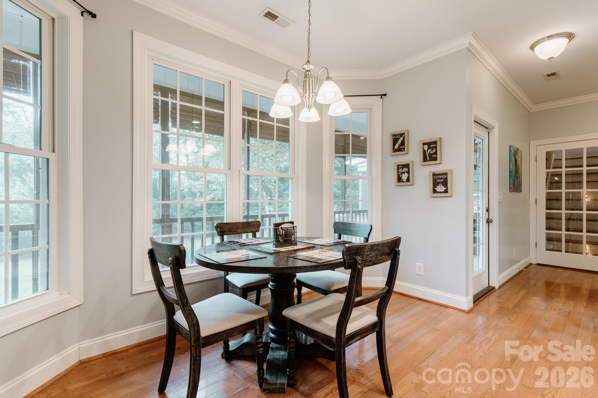 110 Mandy Lane Tryon, NC 28782 - Photo 17 of 48 a view of a dining room with furniture window and wooden floor
