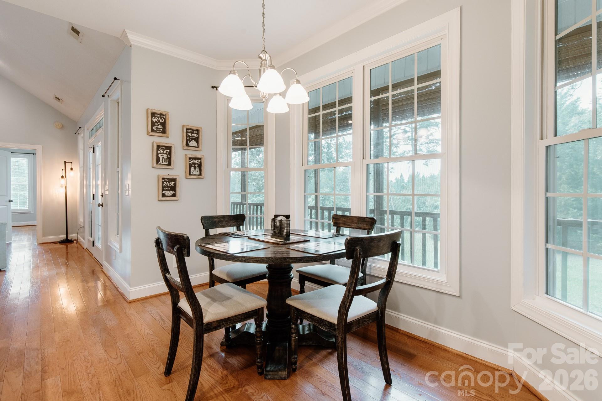 110 Mandy Lane Tryon, NC 28782 - Photo 18 of 48 a view of a dining room with furniture wooden floor and chandelier