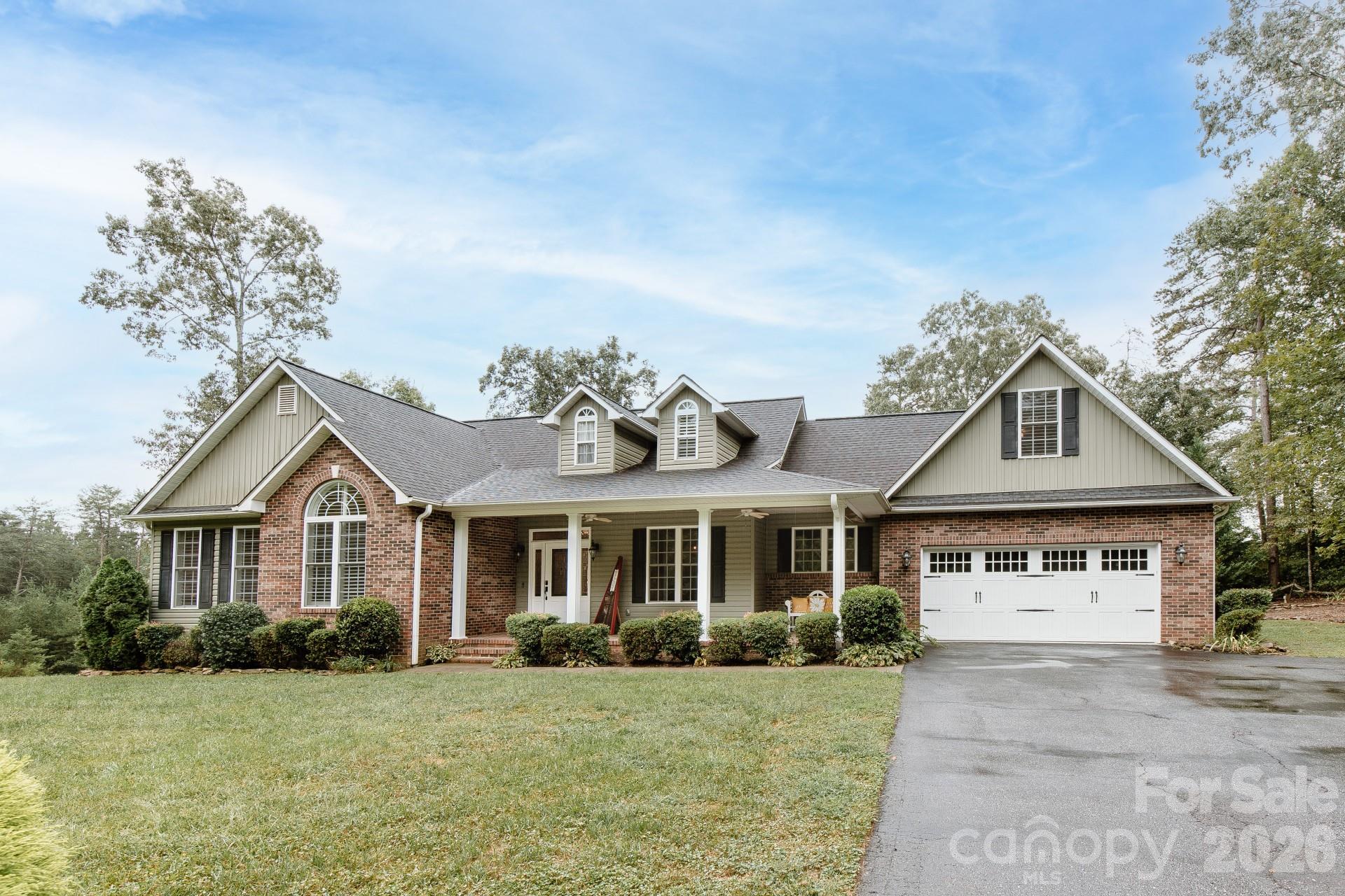 110 Mandy Lane Tryon, NC 28782 - Photo 2 of 48 front view of a house with a yard