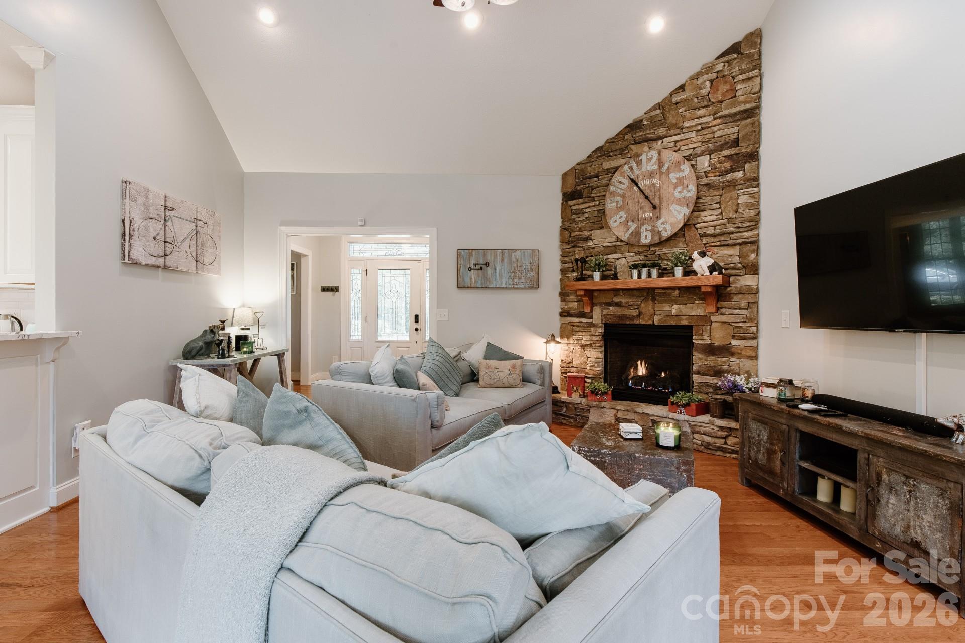 110 Mandy Lane Tryon, NC 28782 - Photo 21 of 48 a living room with furniture a flat screen tv and a fireplace