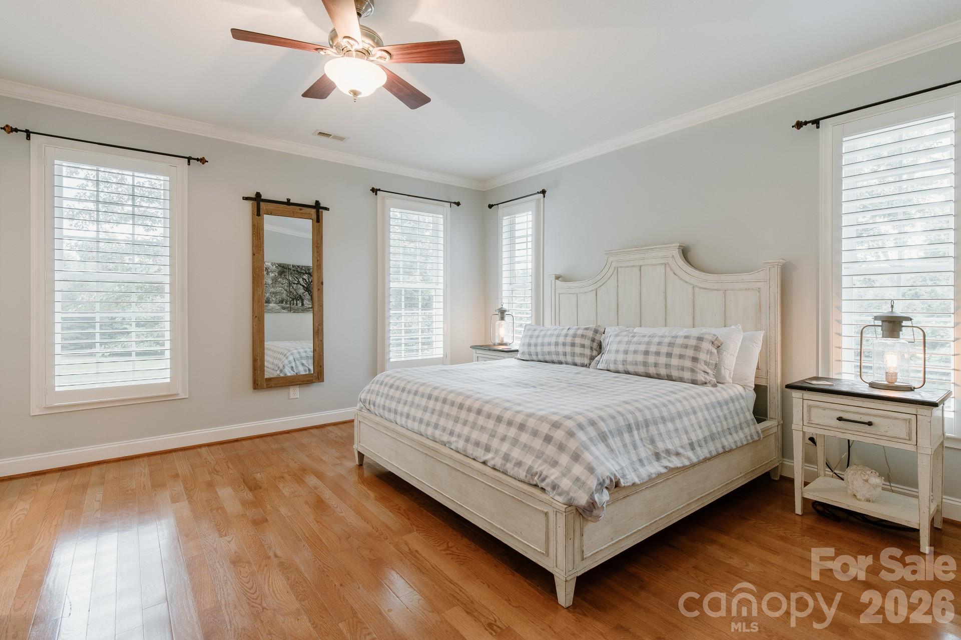 110 Mandy Lane Tryon, NC 28782 - Photo 24 of 48 a bedroom with a bed chandelier and a window