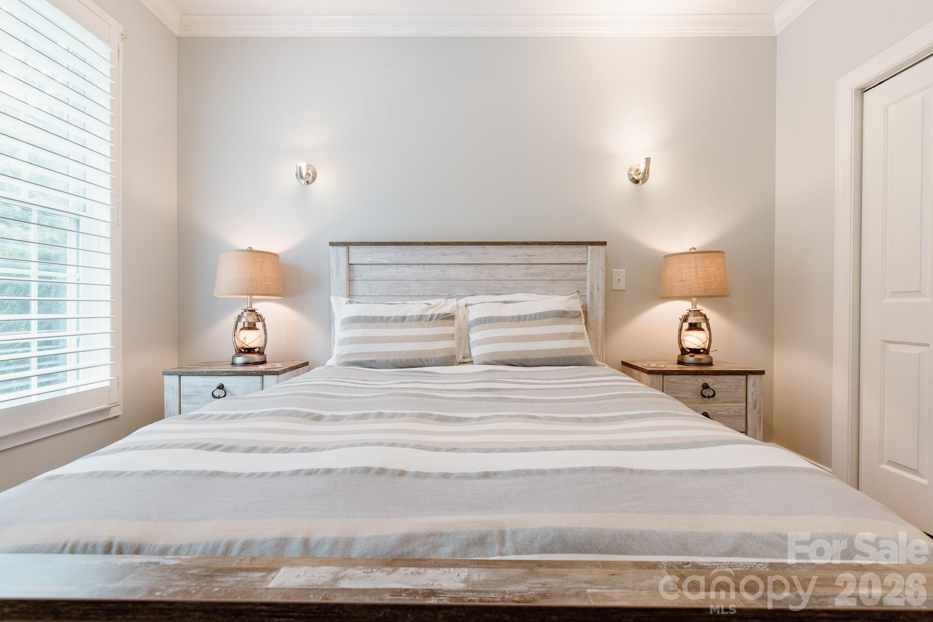 110 Mandy Lane Tryon, NC 28782 - Photo 28 of 48 a bedroom with a bed and a night stand