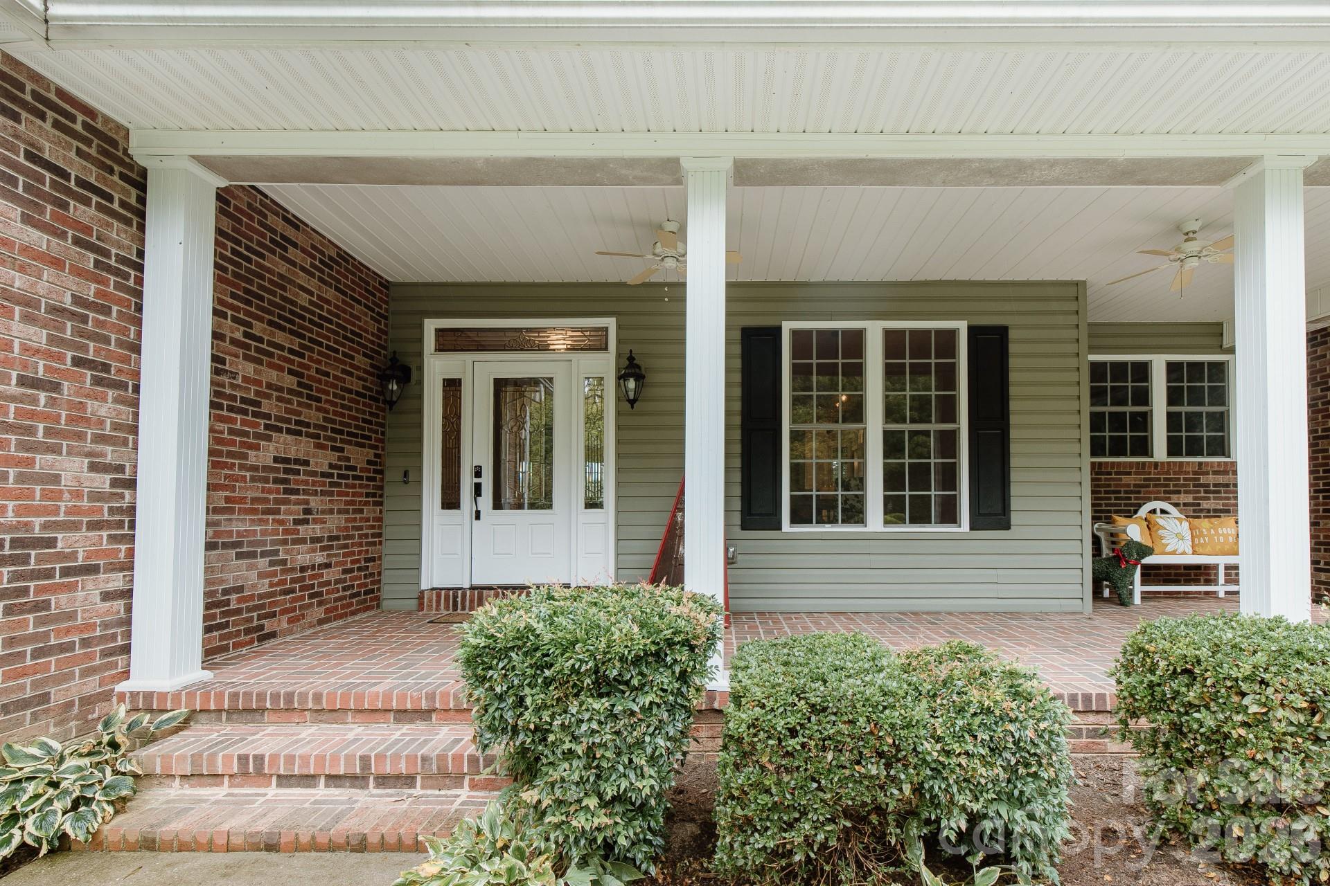 110 Mandy Lane Tryon, NC 28782 - Photo 3 of 48 front view of a brick house with a large window