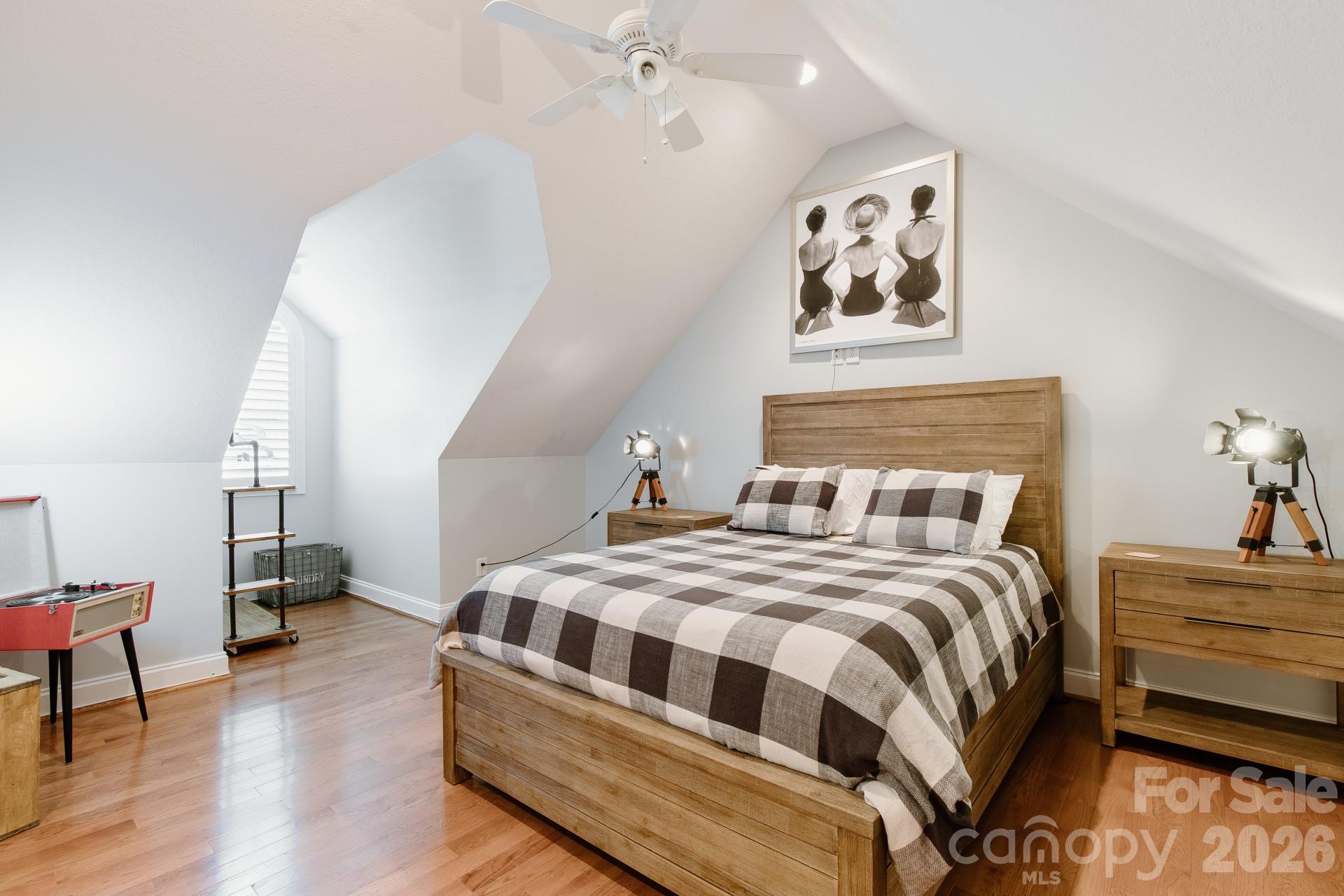 110 Mandy Lane Tryon, NC 28782 - Photo 33 of 48 a bedroom with a bed and a painting on the wall