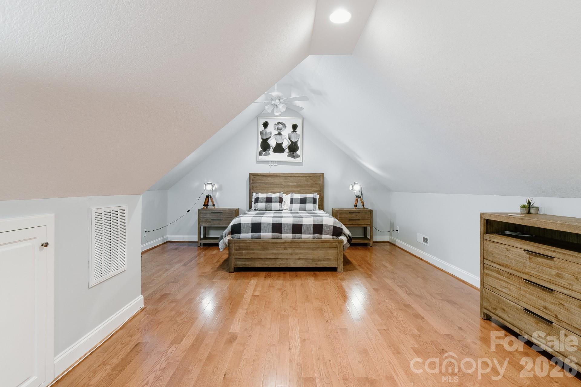 110 Mandy Lane Tryon, NC 28782 - Photo 35 of 48 a living room with a bed furniture and a wooden floor