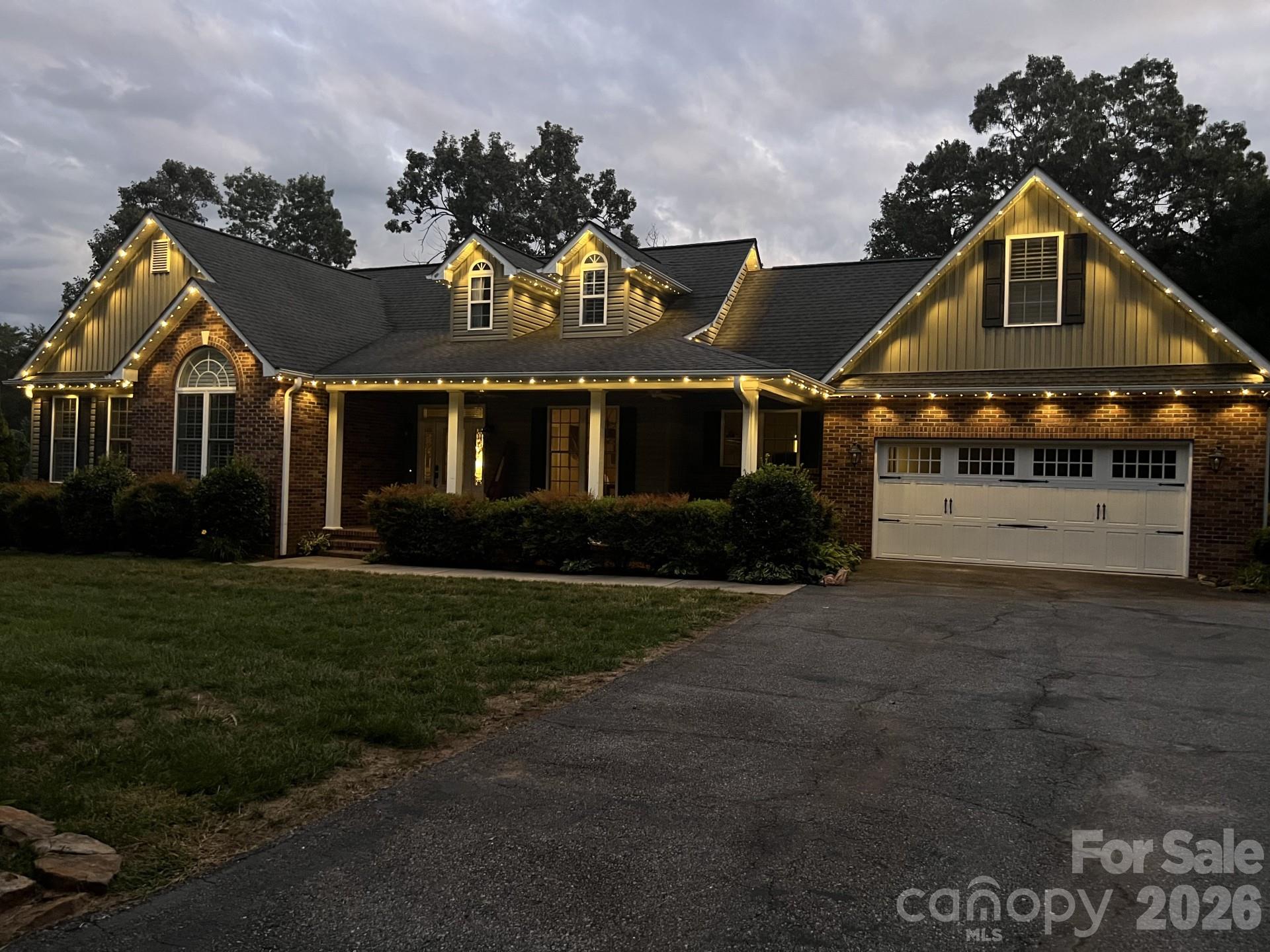 110 Mandy Lane Tryon, NC 28782 - Photo 40 of 48 a front view of a house with a garden and pathway