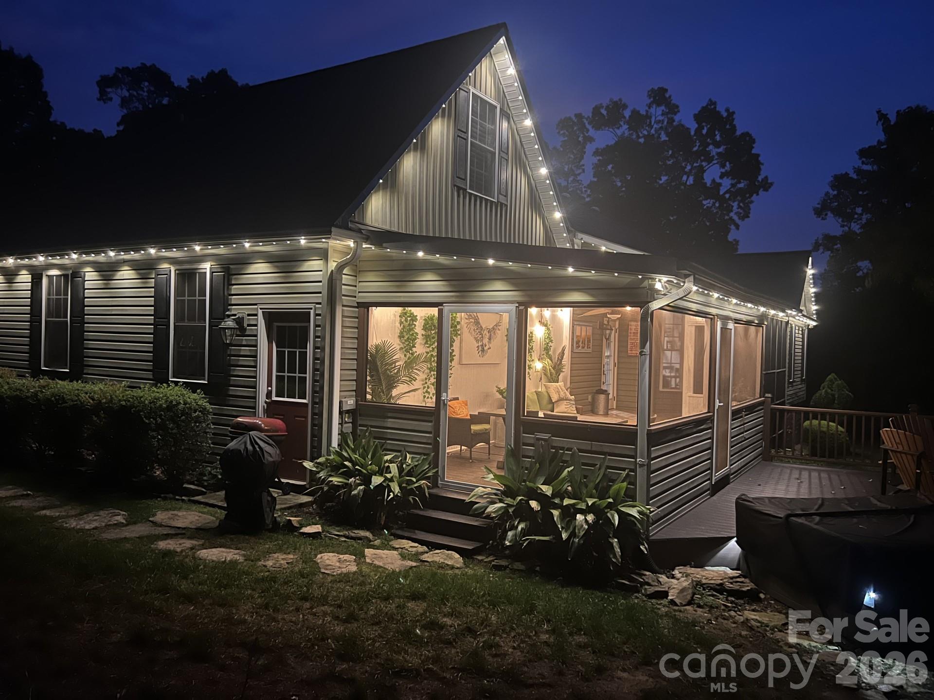 110 Mandy Lane Tryon, NC 28782 - Photo 42 of 48 a view of a porch with furniture and floor to ceiling window