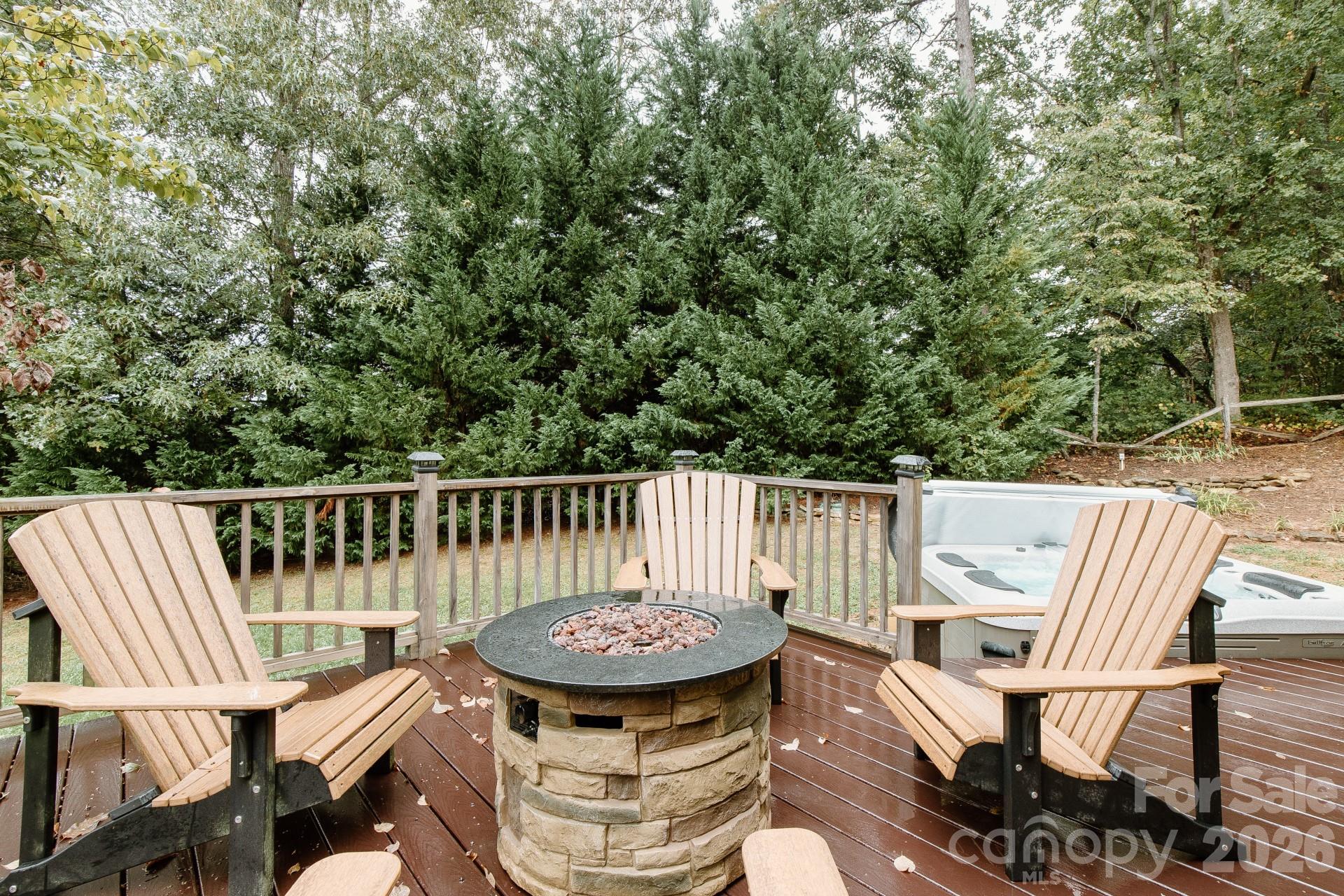 110 Mandy Lane Tryon, NC 28782 - Photo 6 of 48 a view of a chairs and table in the roof deck