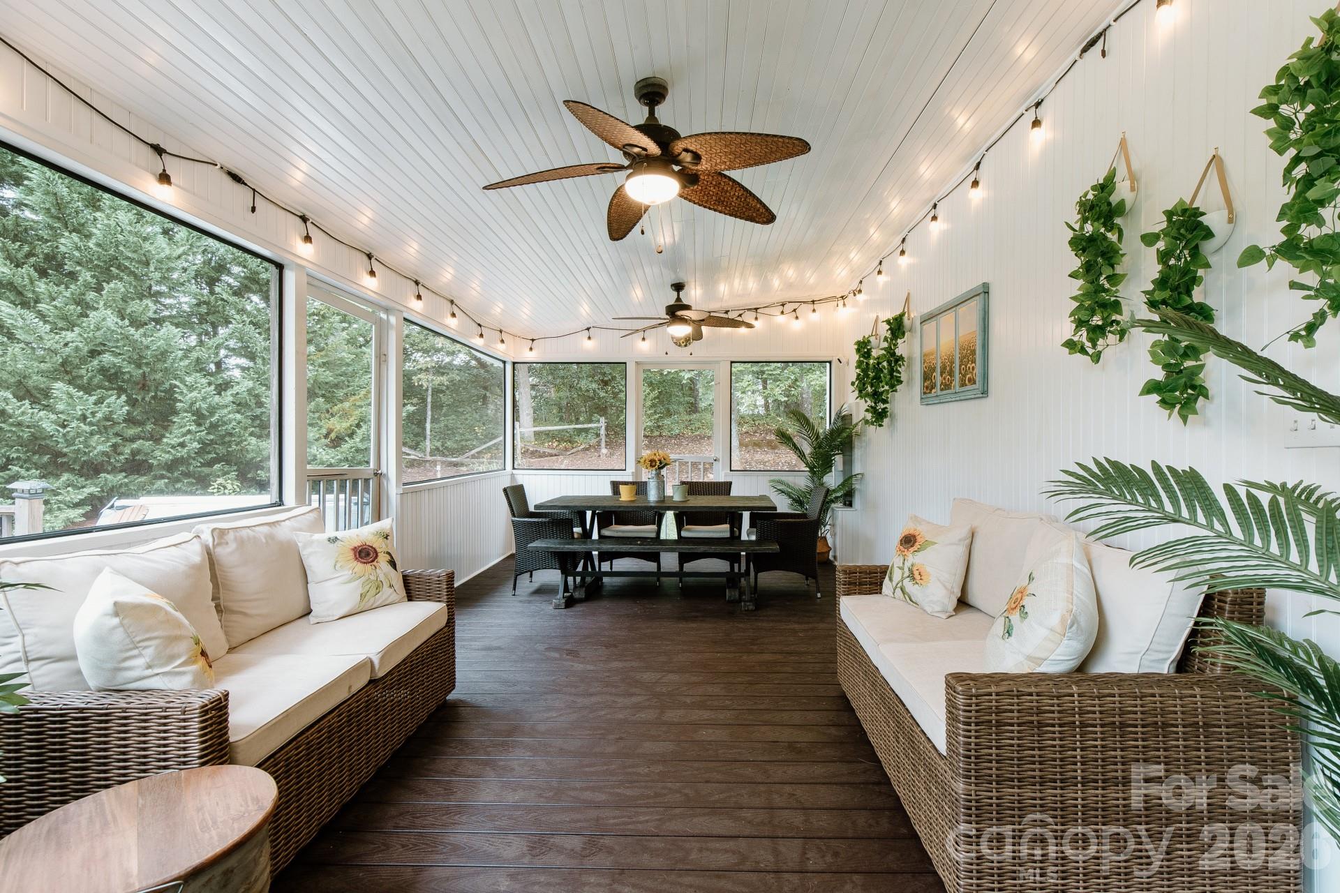 110 Mandy Lane Tryon, NC 28782 - Photo 8 of 48 a living room with furniture ceiling fan and a large window