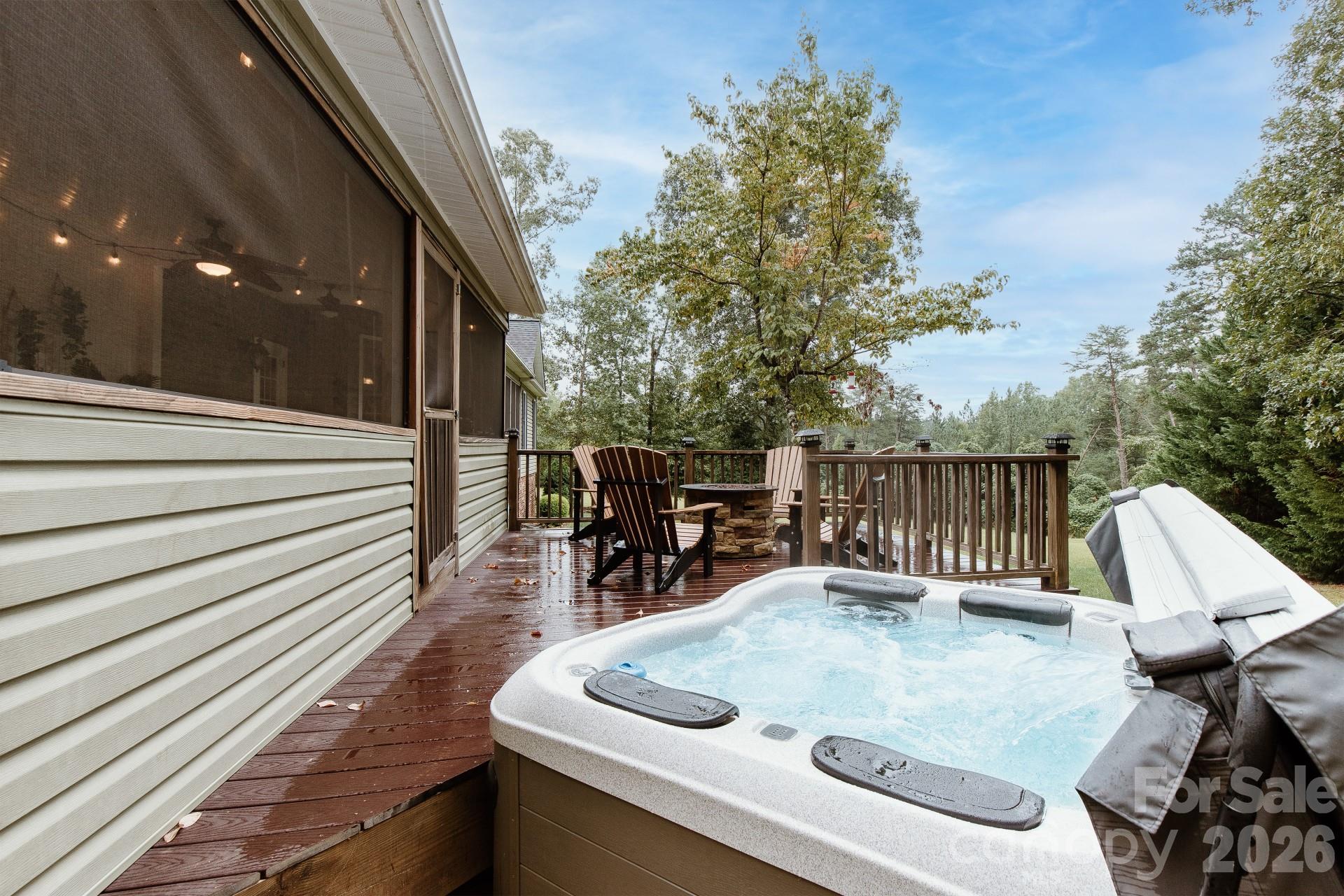 110 Mandy Lane Tryon, NC 28782 - Photo 10 of 48 a roof deck with table and chairs and wooden floor