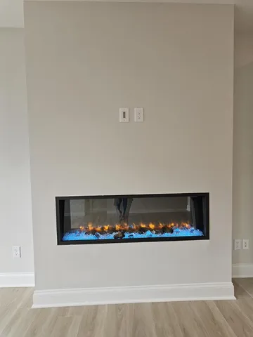 a kitchen with stainless steel appliances granite countertop white cabinets and a sink