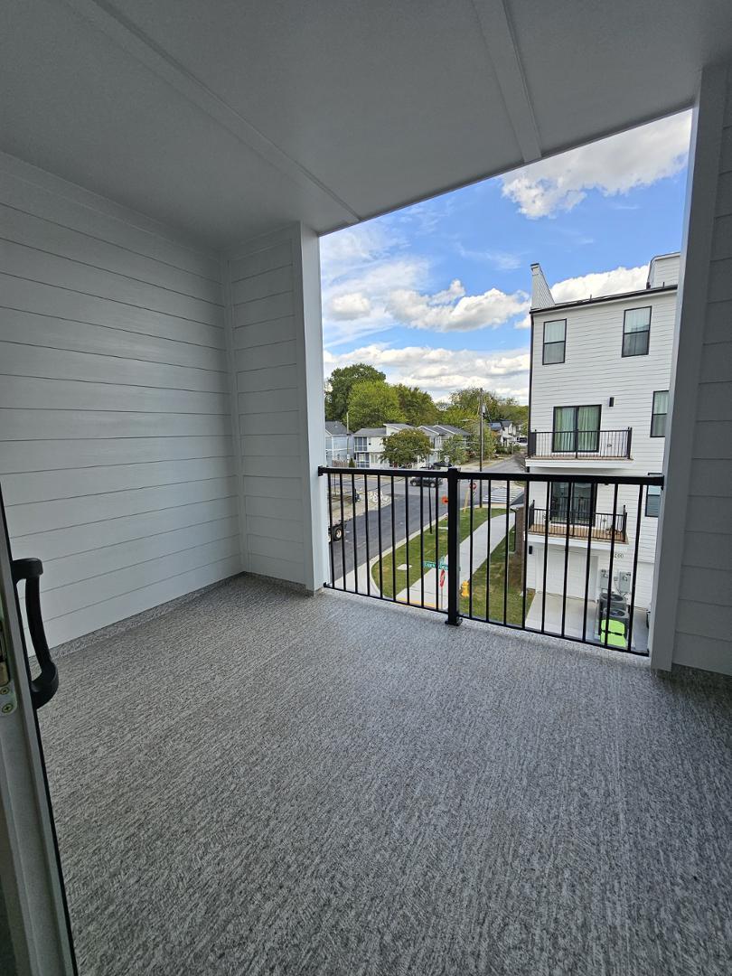 1202 Coach Station Alley, Unit 201 Raleigh, NC 27601 - Photo 7 of 16 a view of a balcony