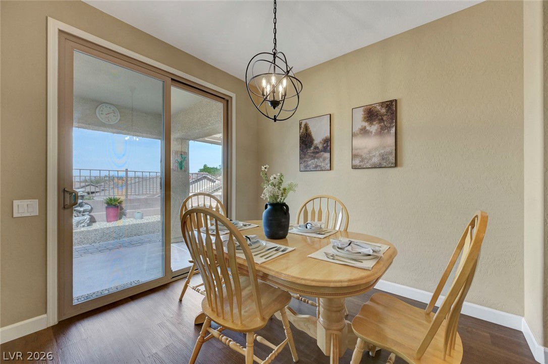 2700 Rue Montpellier Avenue Henderson, NV 89044 - Photo 11 of 39 Dining area with suspended lighting and wood finished floors