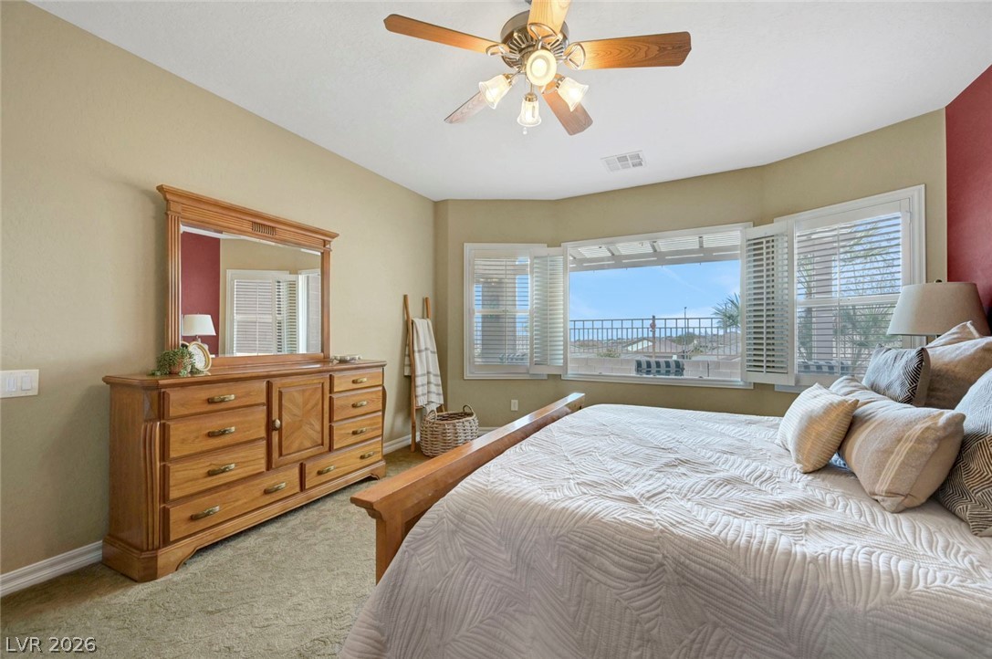 2700 Rue Montpellier Avenue Henderson, NV 89044 - Photo 23 of 39 Bedroom with light colored carpet and ceiling fan