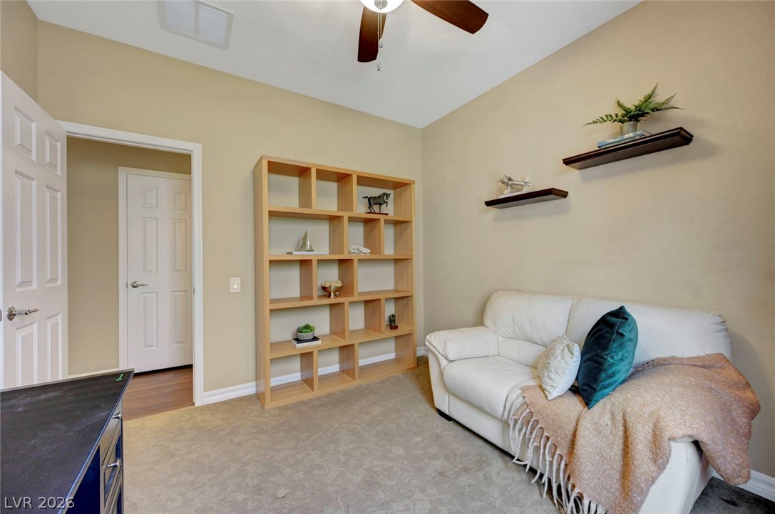 2700 Rue Montpellier Avenue Henderson, NV 89044 - Photo 28 of 39 Sitting room featuring light colored carpet and ceiling fan